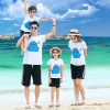 A group of people on a beach Description automatically generated