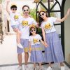 A group of people posing for a photo Description automatically generated with medium confidence