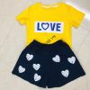 A yellow and blue t-shirt Description automatically generated with medium confidence