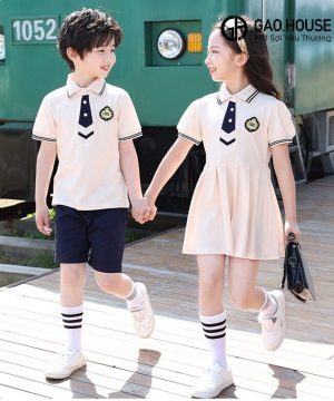Set áo váy đồng phục mầm non màu kem phối đen cá tính