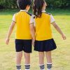 Đồng phục mầm non màu vàng cầu vai DMN02