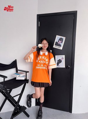 Áo lớp cổ tròn tone be phối cam nổi bật